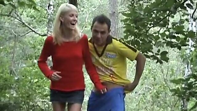 Skinny blond girl flashes her tits in the woods