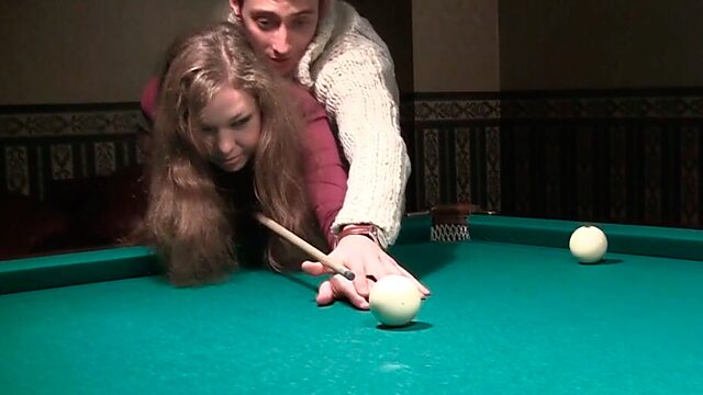 Toples girl with  small tits is playing billiard