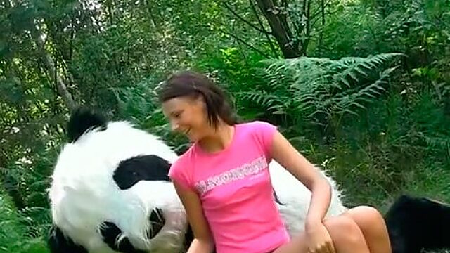 Weird sex in the woods with a huge toy panda with strap on