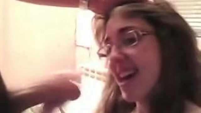 Cute nerdy brunette takes messy facial after giving blowjob