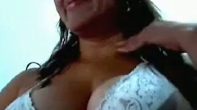 Amateur black haired bitch with ugly face shows off her really huge boobs
