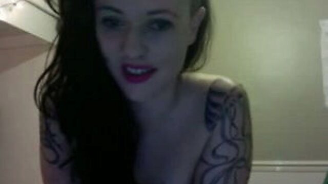 Tattooed webcam model is comfortable with her own body and she loves showing off