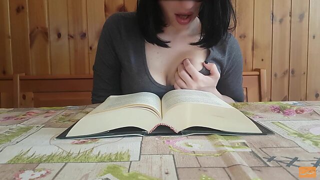 Reading books is so arousing that a brunette orgasms during it