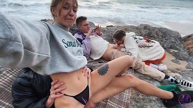 Two couples of perverted friends came to the beach to throw a swinger party