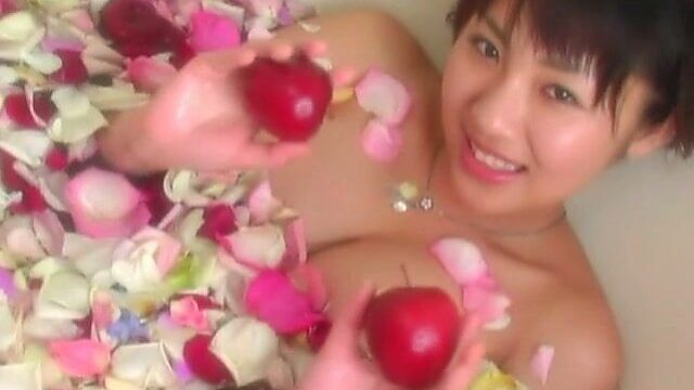 Romantic Asian chick Megumi Kagurazaka takes a bath with rose petals