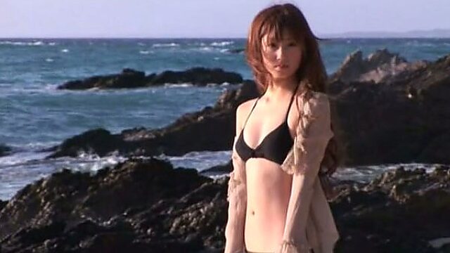 Magnetizing babe Yuko Ogura is having fun on a beach
